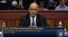 Judge Hector LaSalle in a suit, testifying during a state senate committee hearing.