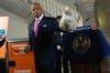Mayor Adams holds a bag of compost before he tosses it into a new NYC Composting bin at City Hall.