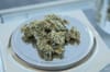 A pile of nugs on a digital scale.