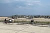 The Rockaway Beach boardwalk, on a sunny day.